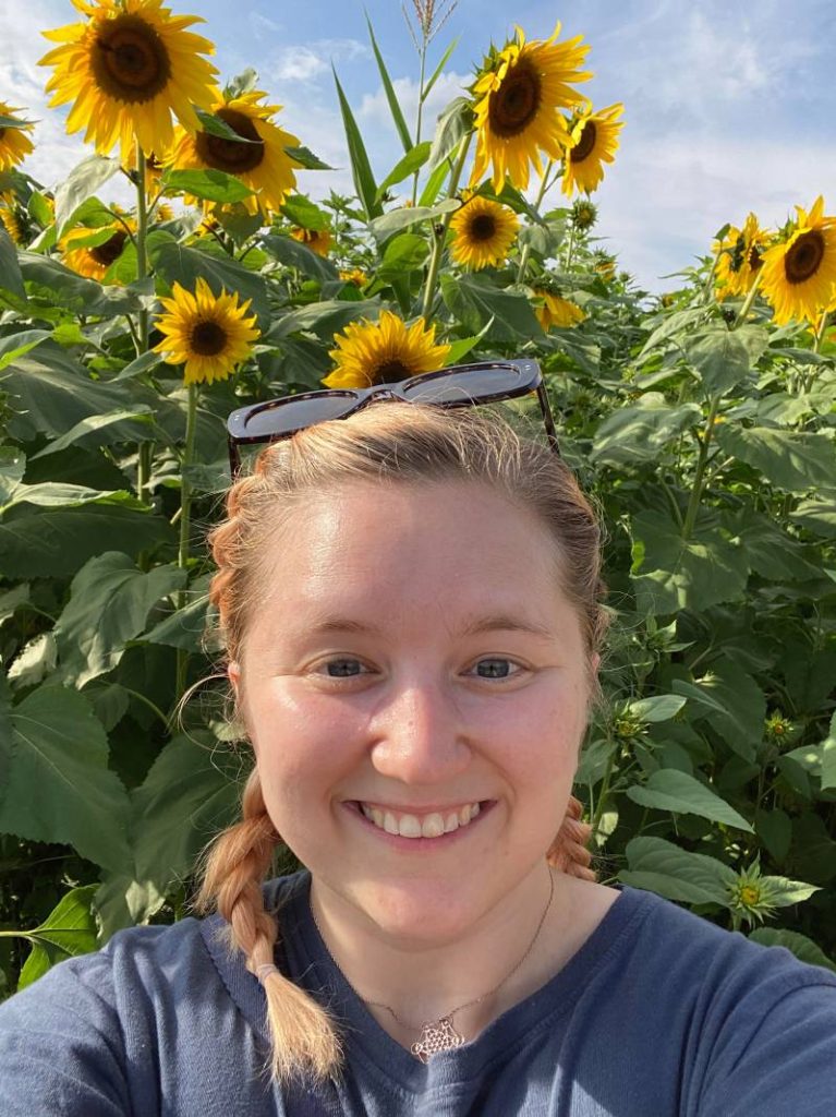 image of Karina with sunflowers